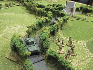 Cromwells take up defensive positions in the bocage lane supported by infantry.