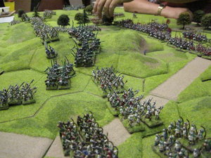 The Tudor armies quickly advance to take posession of the 15hex hill in the centre of the table.