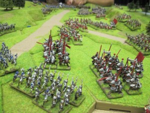 Two units of  Lancastrian heavy cavalry charge the Yorkist bill units which stubbornly hold their ground