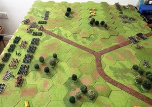 A view of both sides deployment. The orcs a solid mass dominate the centre, but the barbarians hold their cavalry strength on each flank