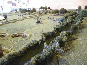 Bocage lane with British infantry dug in front of the village