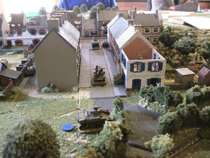 Stuart tanks wait in ambush on the east side of the village to defend the bocage lane