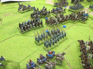 The mounted units of both sides fight for control of the centre of the table.